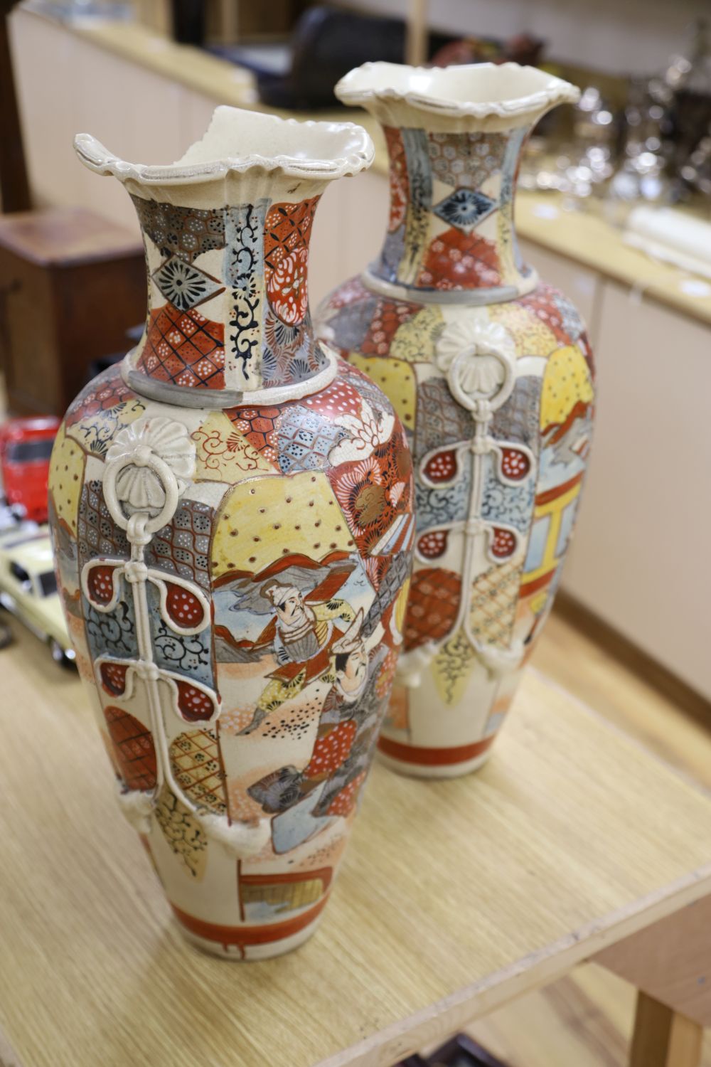 A pair of 19th century Satsuma vases, brocaded with figures, height 58cm (one a.f.)